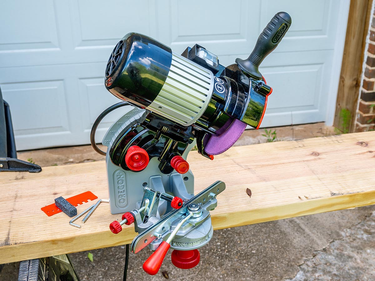 The Oregon 410-120 Bench Grinder Chain Sharpener mounted to a board during testing.