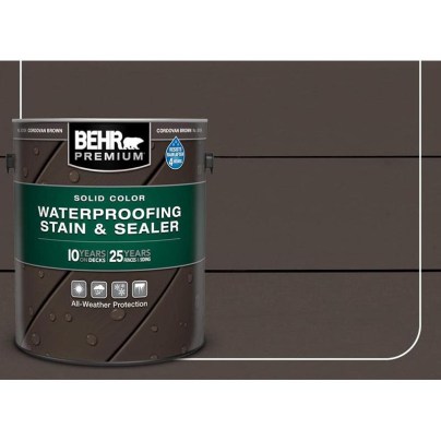 The can of Behr Premium Solid Color Waterproofing Stain & Sealer on a dark background.