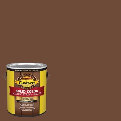 A can of Cabot Solid Color Acrylic Stain & Sealer on a brown background.