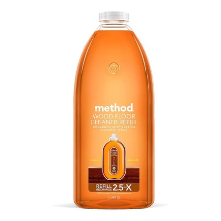  A bottle of Method Squirt + Mop Hardwood Floor Cleaner on a white background.