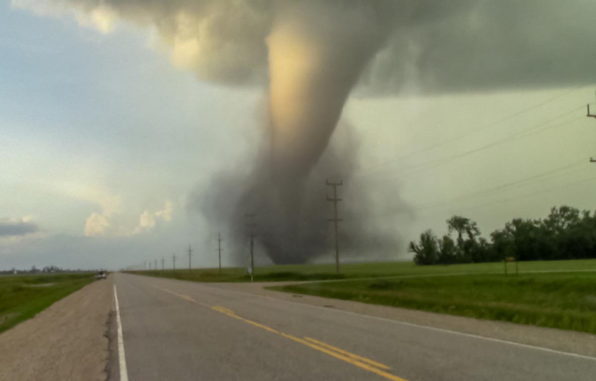 A photo of a tornado touching down. 