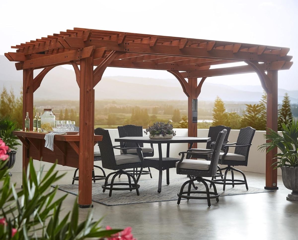 Dark wooden pergola with outdoor dining table and seating.