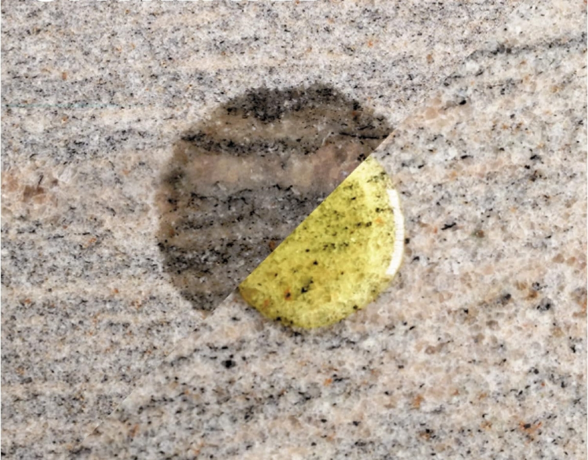 A comparison of a drop of oil versus a drop of oil that has been absorbed on granite countertop.