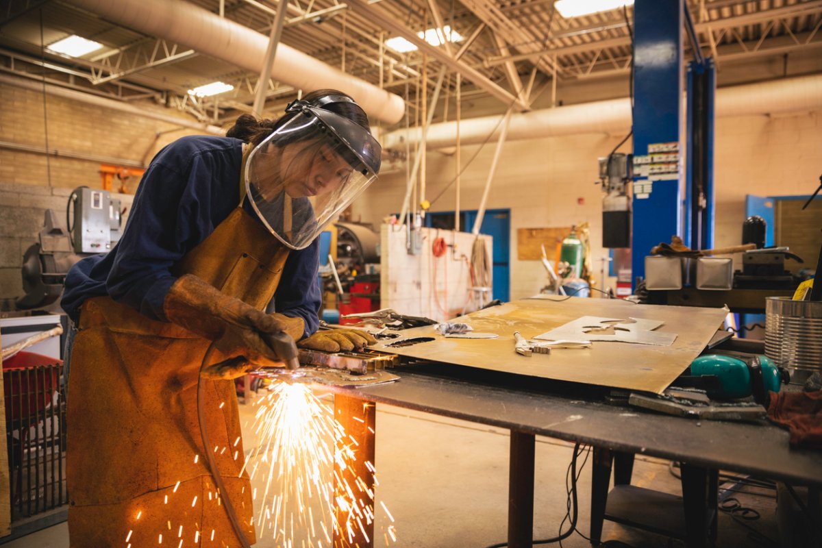 A welder at work in a workshop.