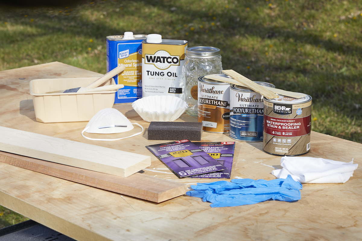 Materials needed for three methods for waterproofing wood, including Danish oil, polyurethane, and stain and seal.