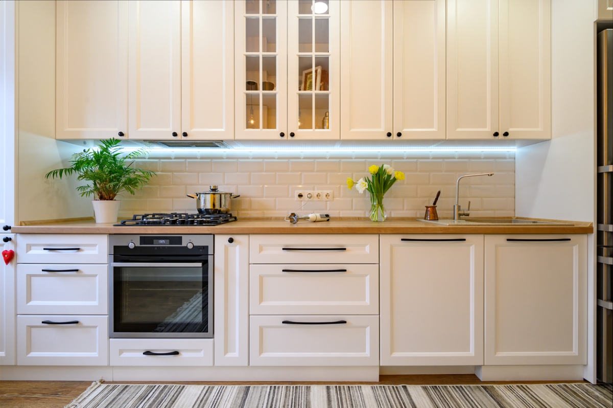 Kitchen cabinets with lighting underneath.