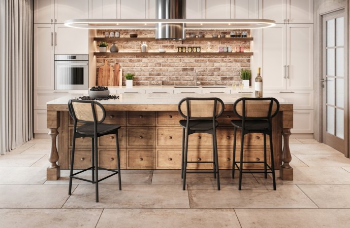 Modern kitchen island with black boho chairs.
