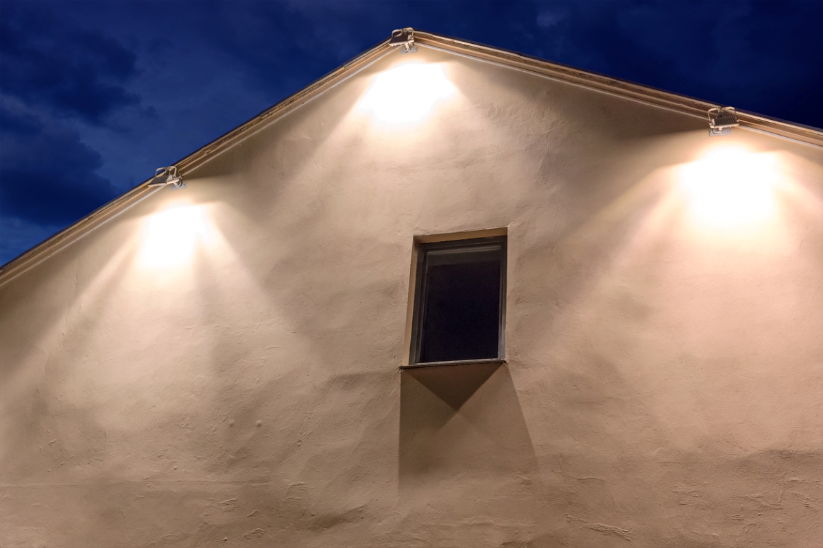 Three very bright flood lights on top of home.