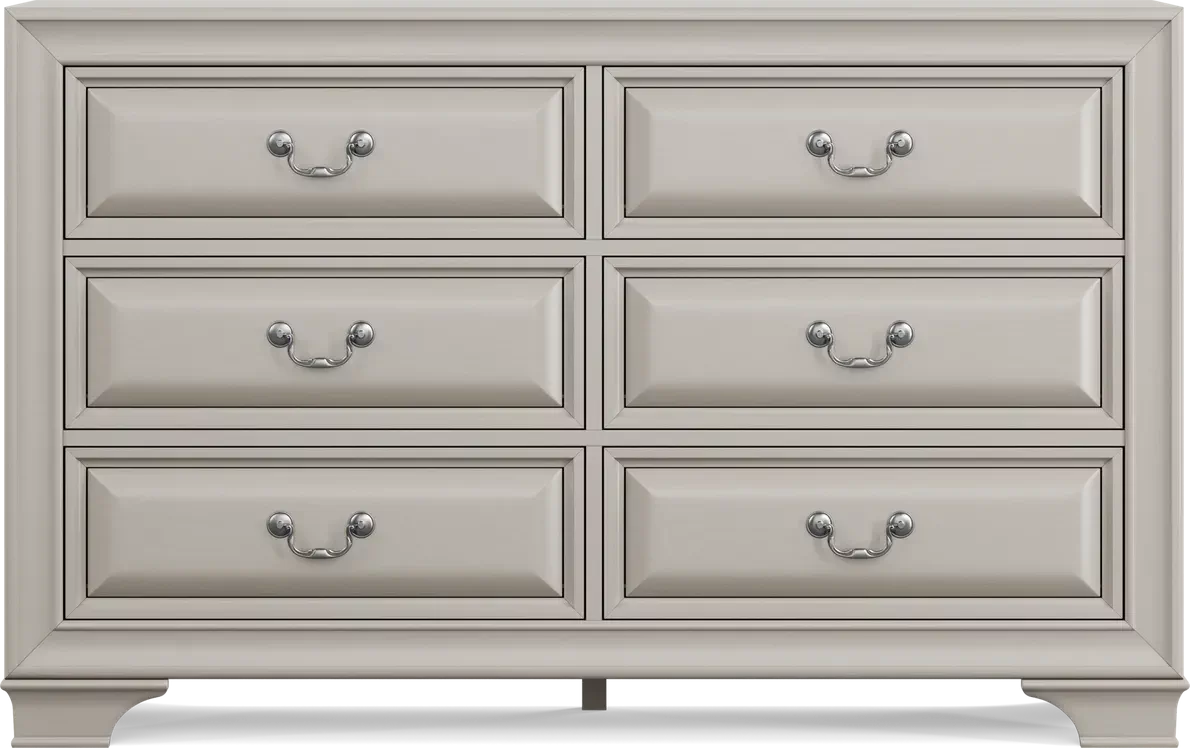 An off white dresser is against a white background.