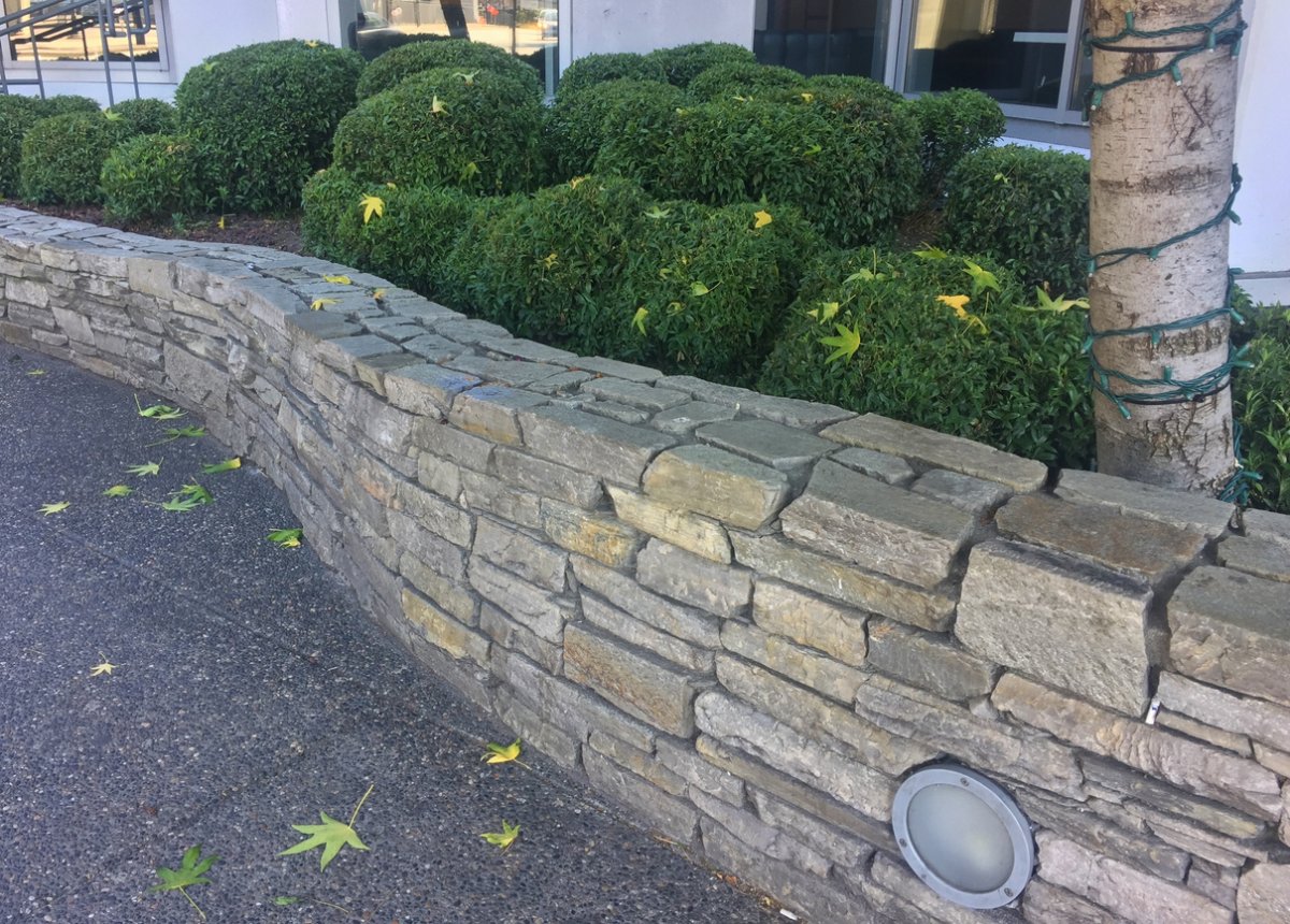 A view of a railroad tie retaining wall.