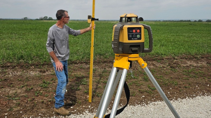 A person using the TopCon’s RL-H5A Laser Level for surveying during testing.
