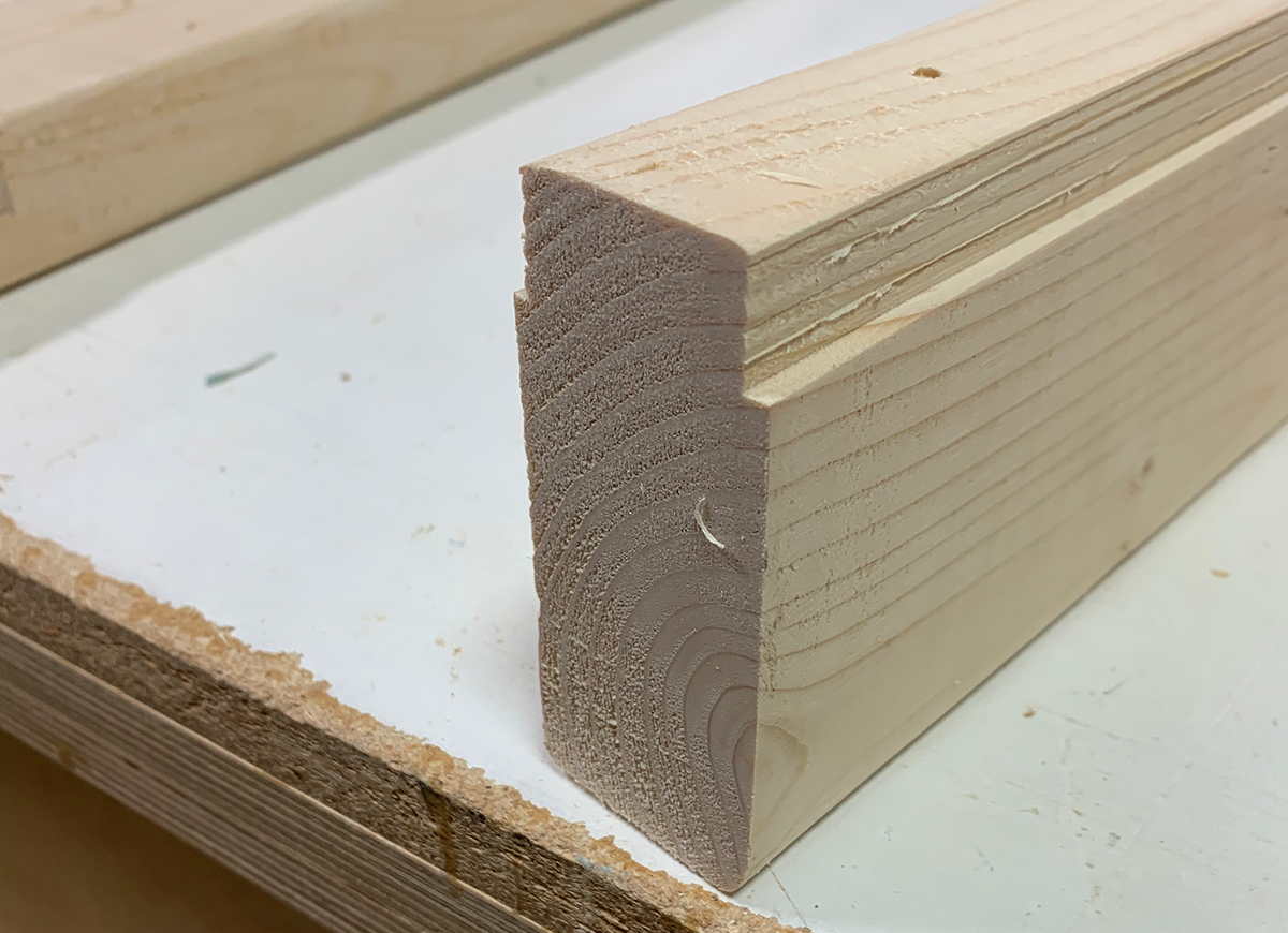 A detail view of the grooves cut into the top rail of Bob Vila's diy sawhorse project plans.