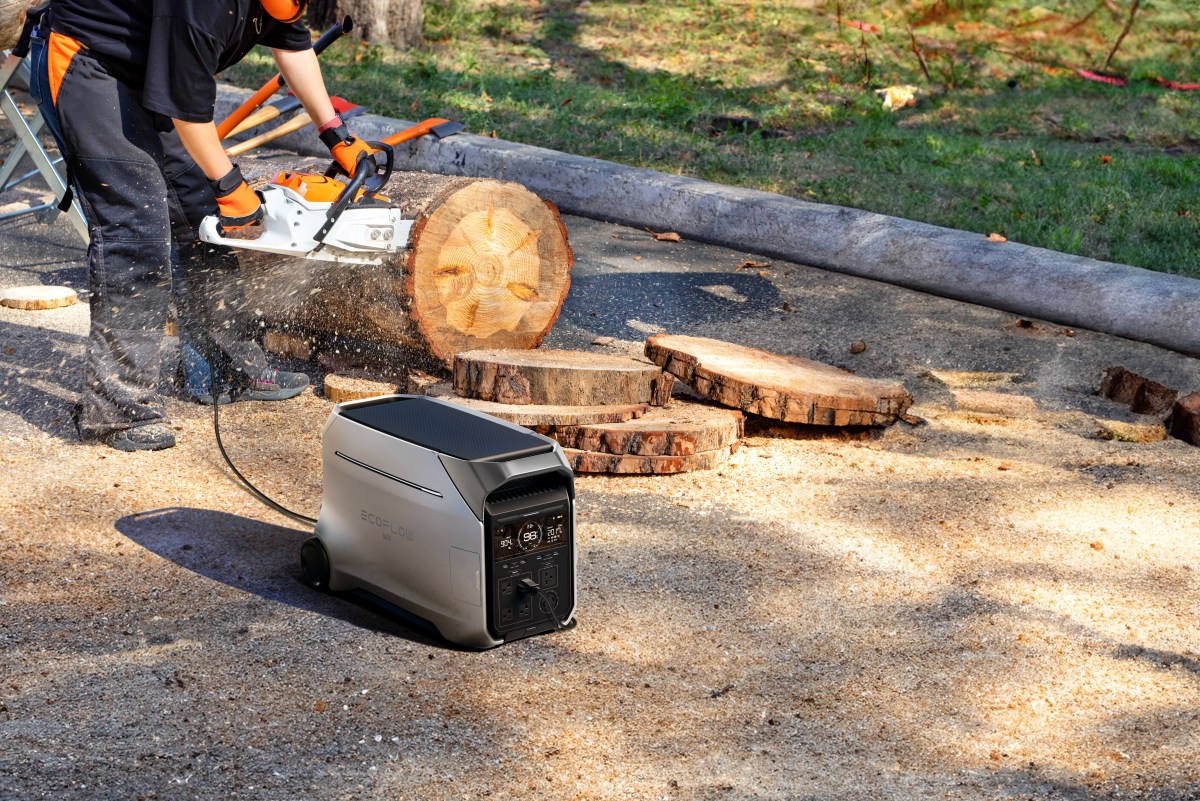 EcoFlow Delta Pro 3 powering a saw to slice through a fallen tree