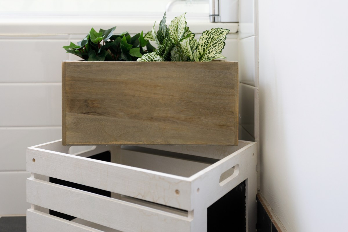 Wooden crates repurposed as planters and storage.