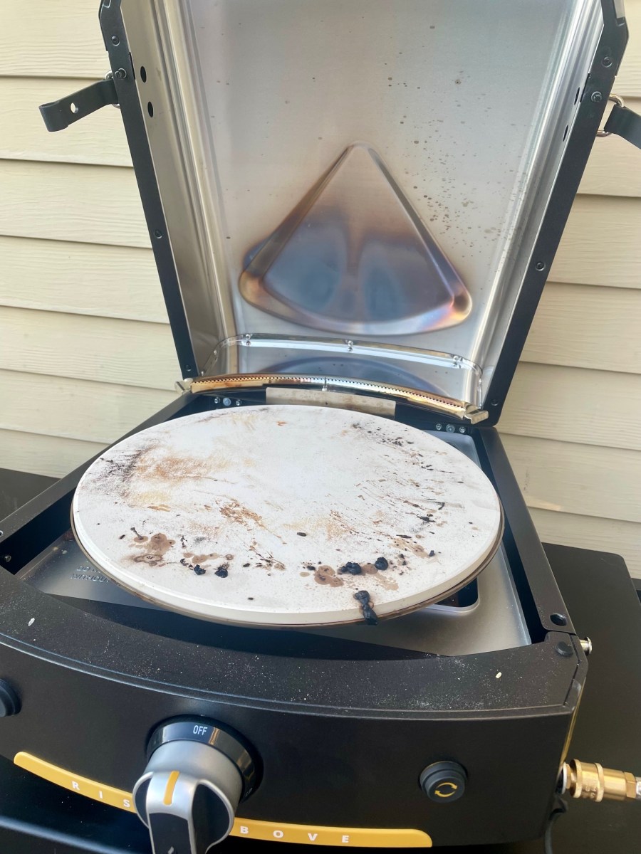 The lid on the Halo pizza oven open during testing.