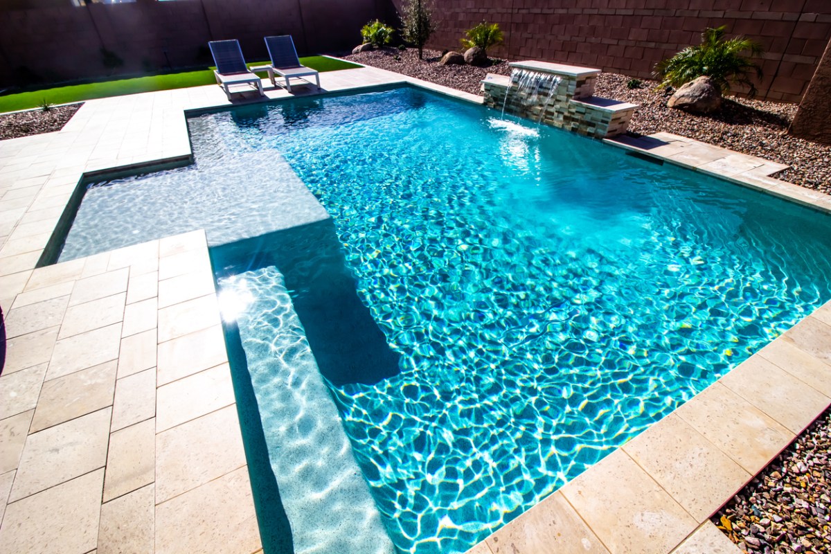 A sparkling backyard pool with tile edging.