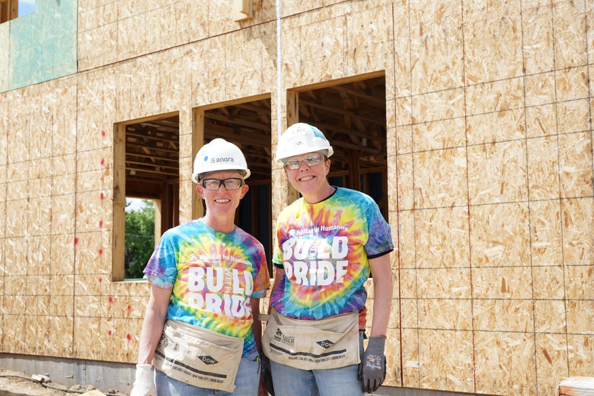 A pair of volunteers pose for the 2024 Pride Build Metro Denver event.