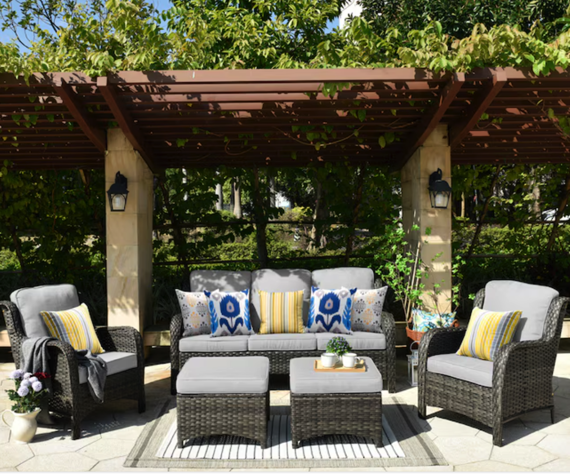 Ovios 5-Piece Wicker Patio Conversation Set set up on patio under pergola