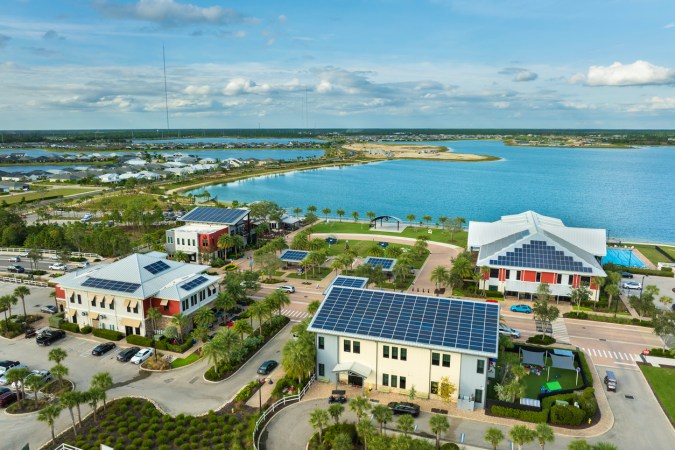 A view of Florida homes with solar panels on their roofs.