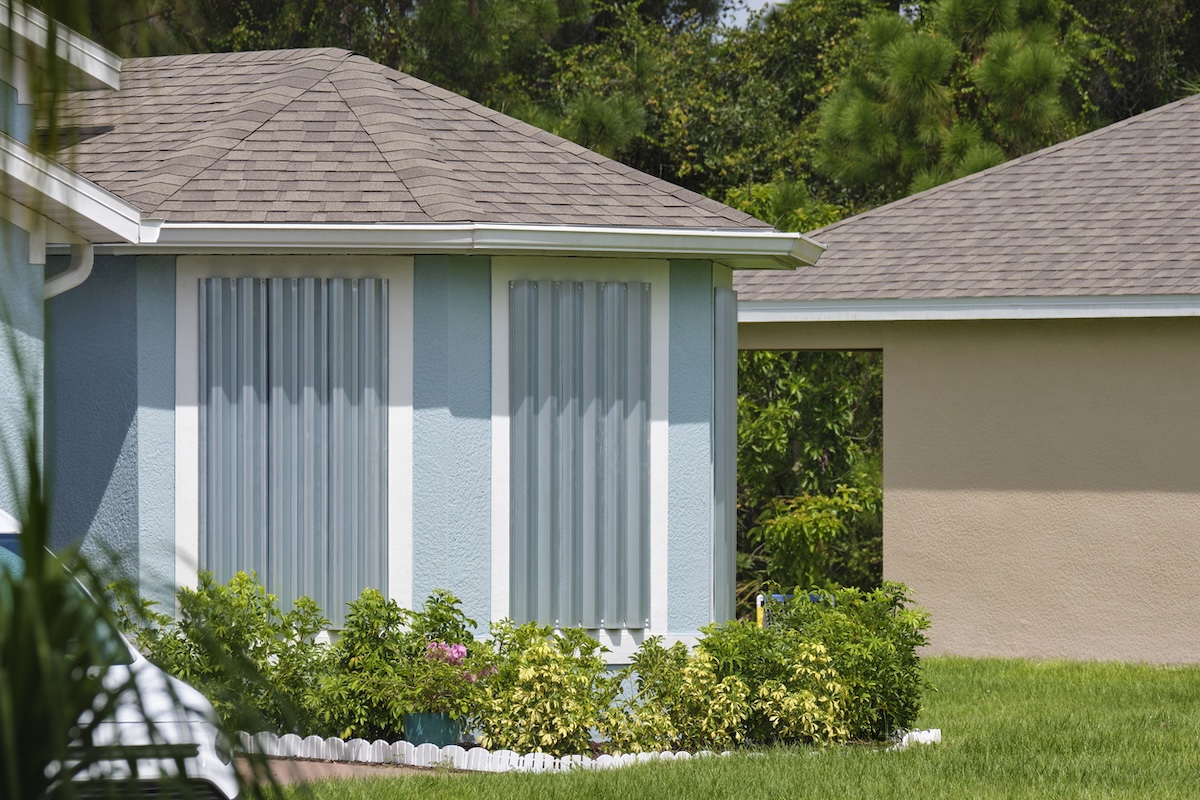 A home with hurricane shutters installed in preparation for a natural disaster.