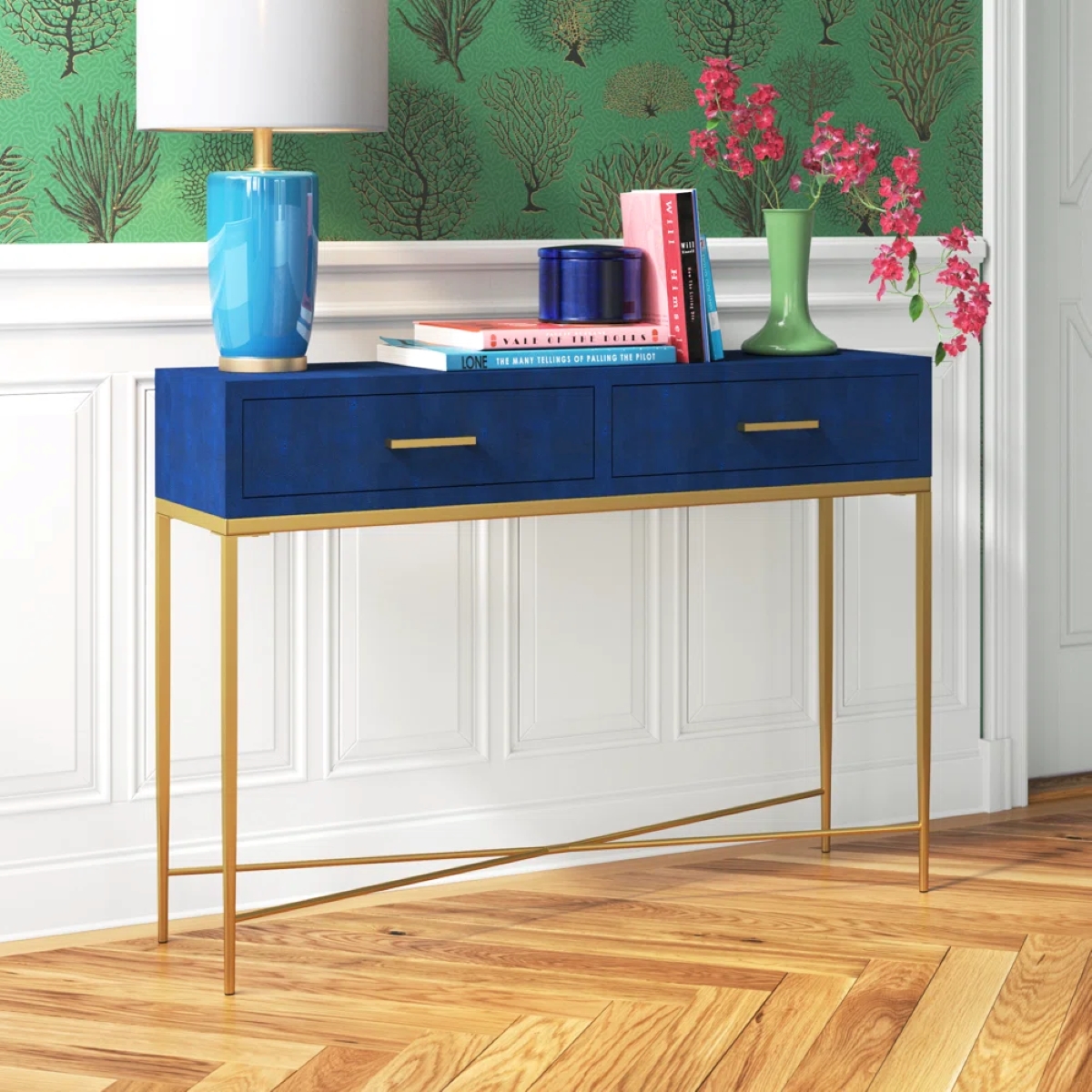 A blue hallway side table with long furniture legs.