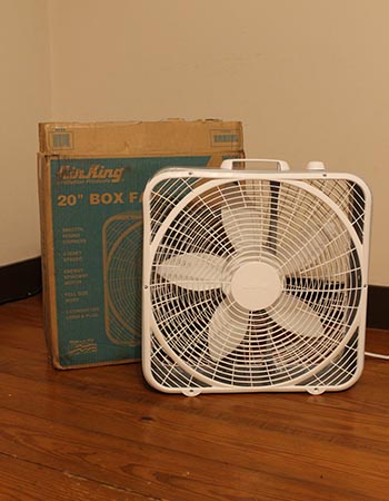 Air King Commercial-Grade Box Fan with box in room