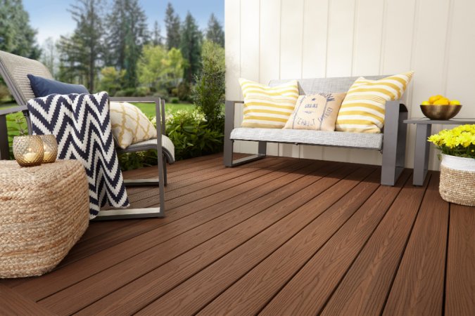 The Best Composite Decking in warm brown with beige couch