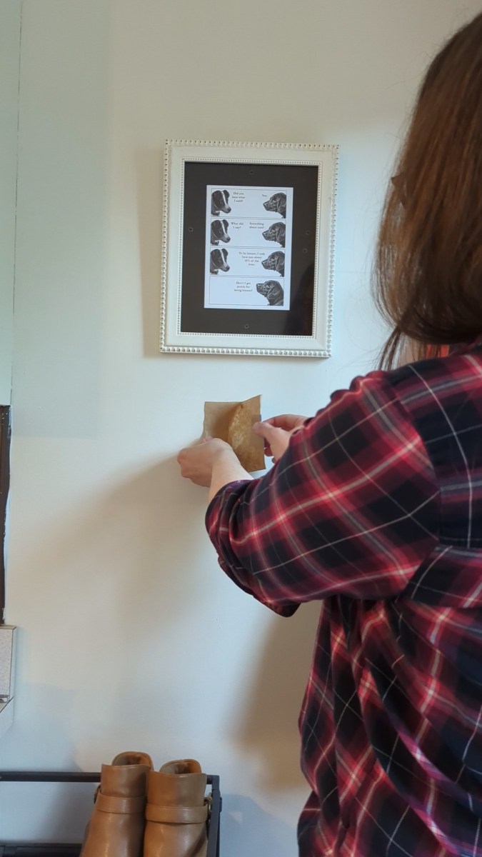 Brown paper template shows where to nail in picture-hanging hack