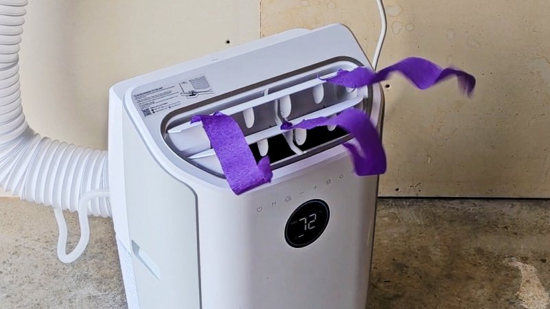 Dreo portable AC with purple streamers flowing from its louvers