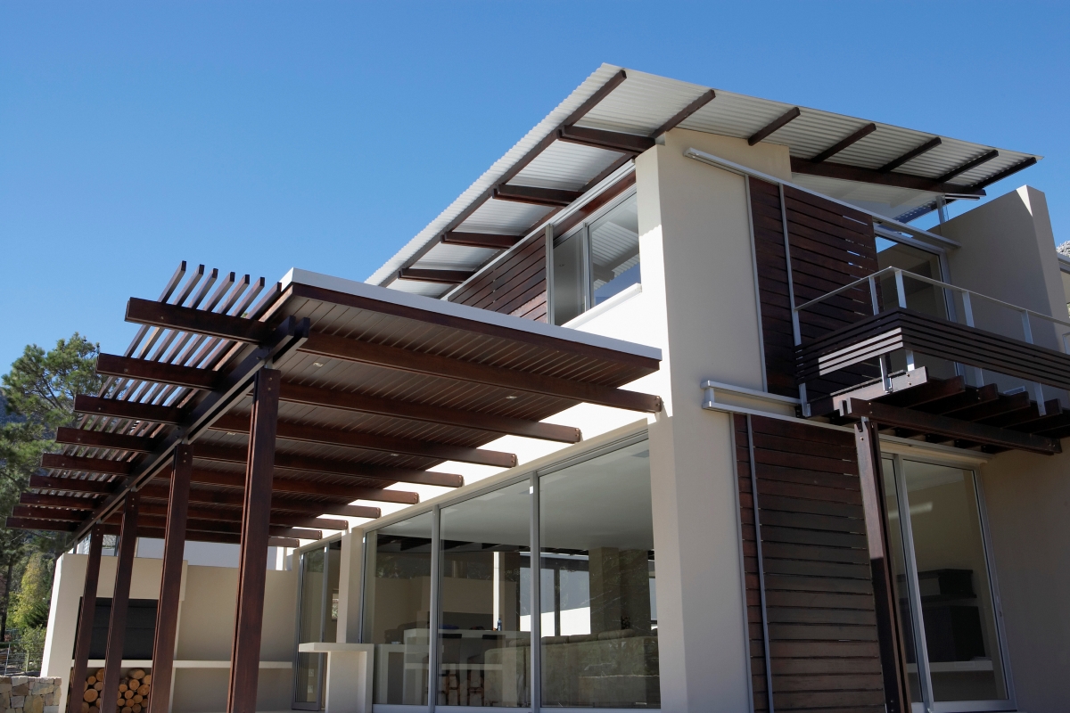 Modern home with large extended shade awnings.