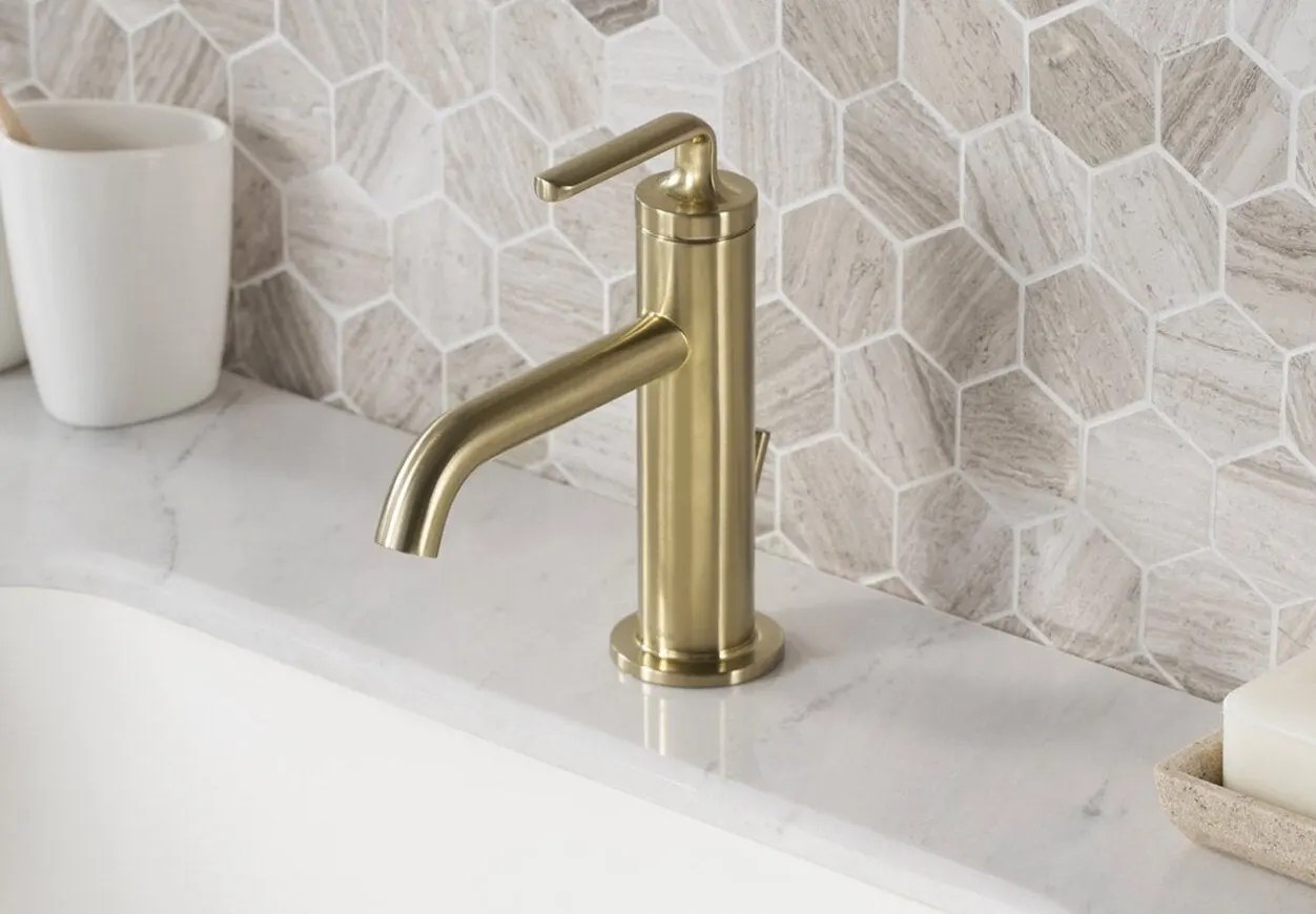 Kraus' Ramus single-hole bathroom faucet on a sink with a marble top.