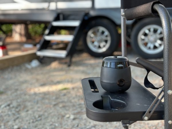 Thermacell mosquito repellent used outdoors on a campsite