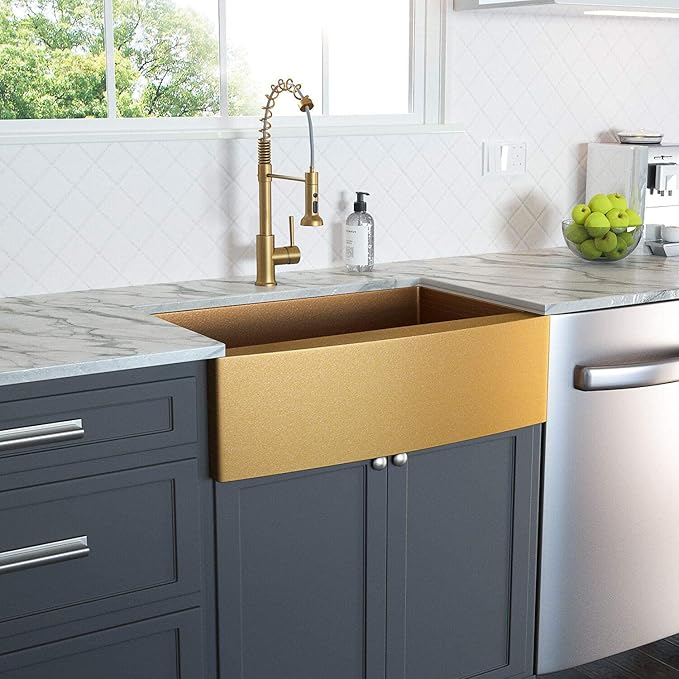 Lordear gold farmhouse sink surrounded by dark grey kitchen cabinets.