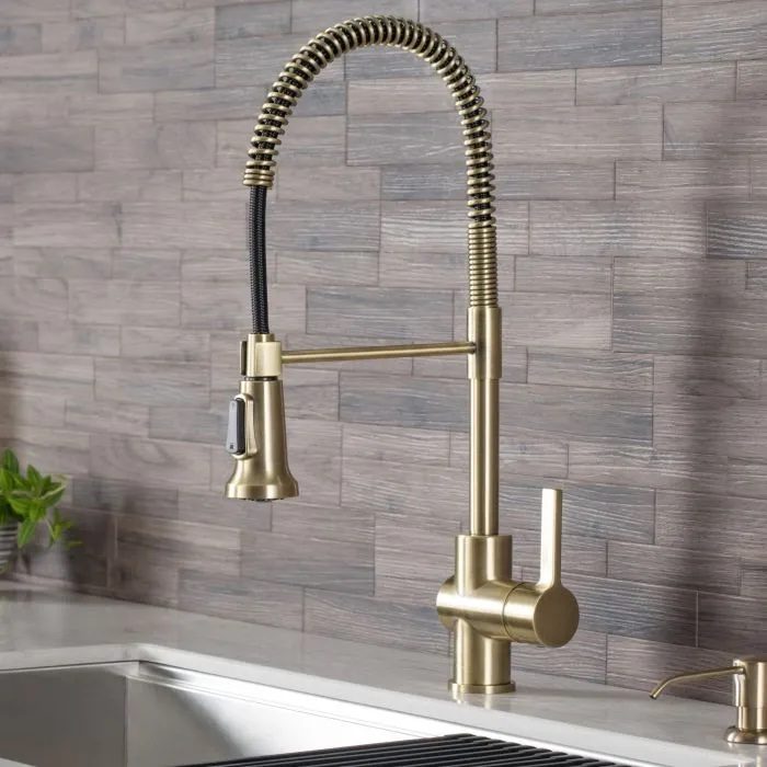 Kraus Britt gold faucet with pull out sprayhead.