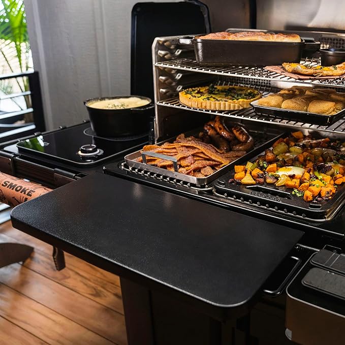 Traeger PAL folding shelf on a Traeger grill with food cooking