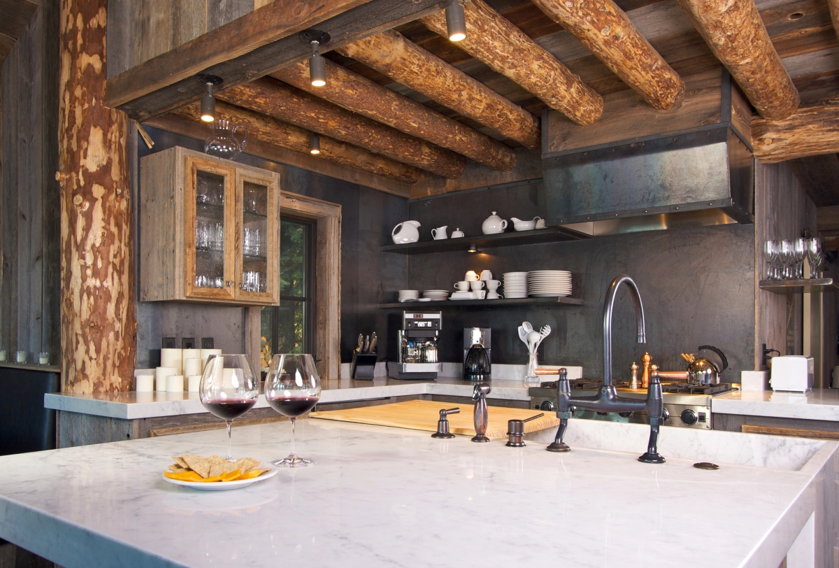 A modern kitchen in a log cabin.