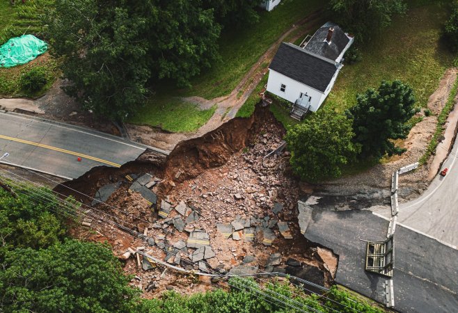 Sinkhole behind white house.