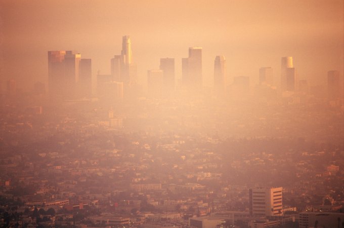 City covered in orange-looking air due to air pollution.