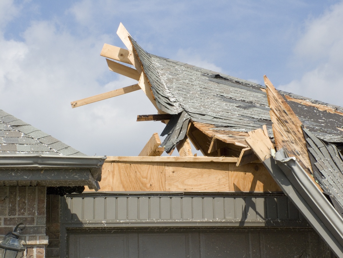 House roof damaged during tornado winds.