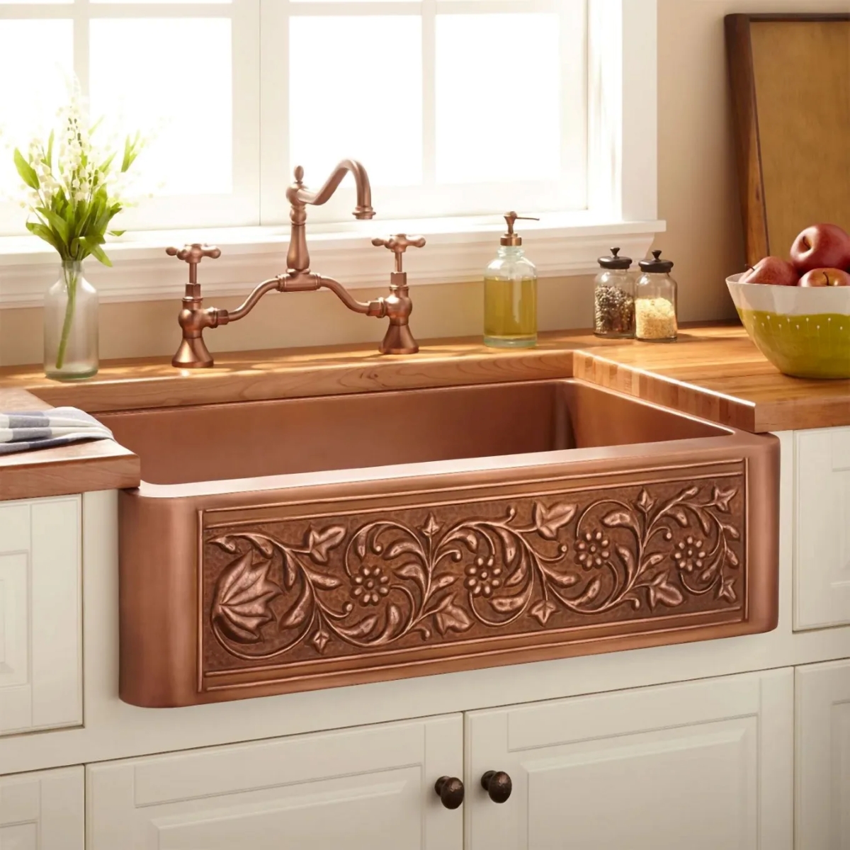 A kitchen with a decorative antique copper sink.