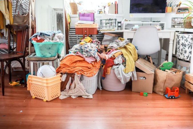 A cluttered room in a normal American home.