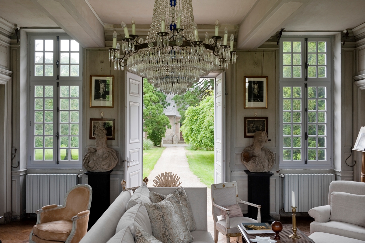 A villa with a large chandelier as the light fixture statement.