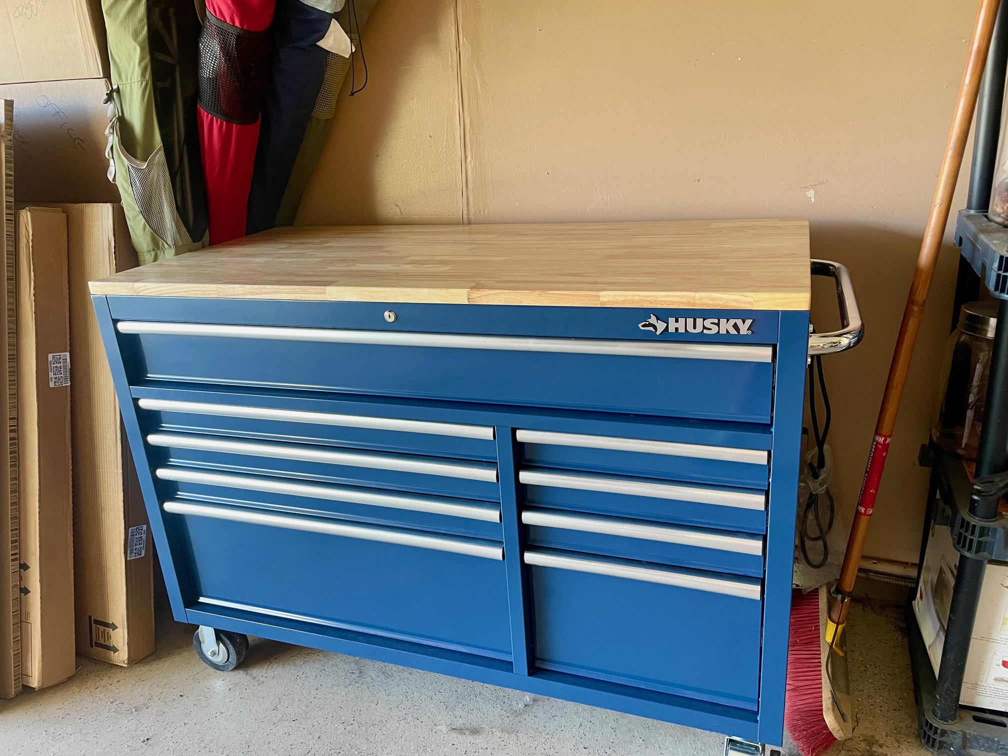 Husky 9-drawer tool chest set up in a garage