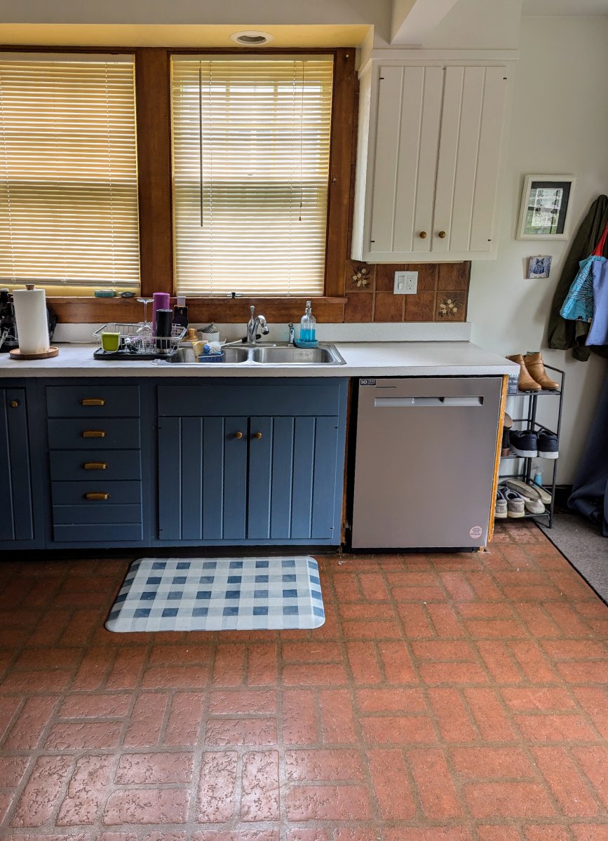 Vinyl kitchen floor in brick design near the sink