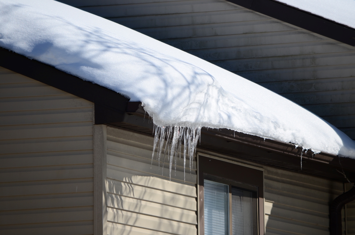 A large ice dam on roof of a home.