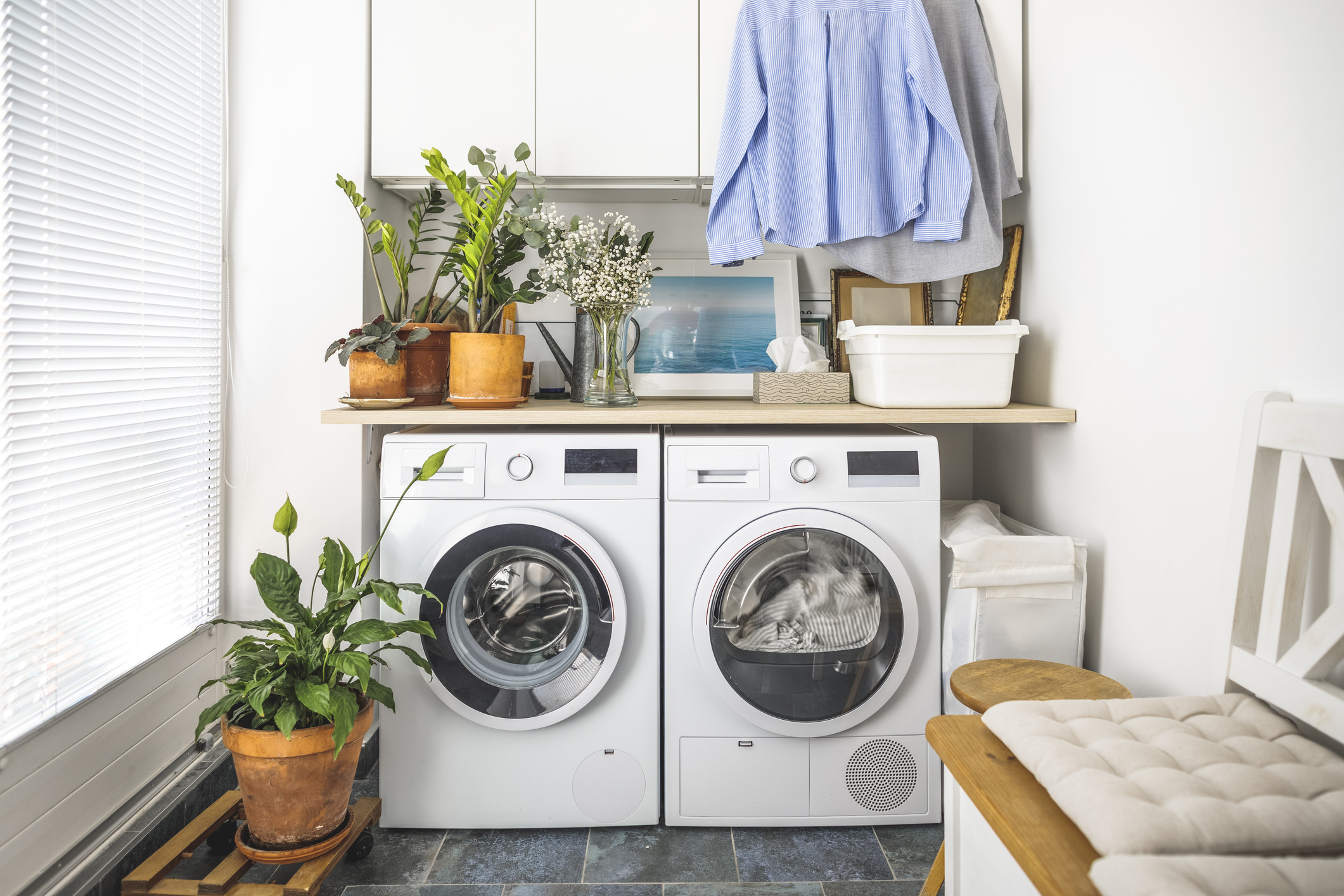 Modern looking laundry room with white washer and dryer.