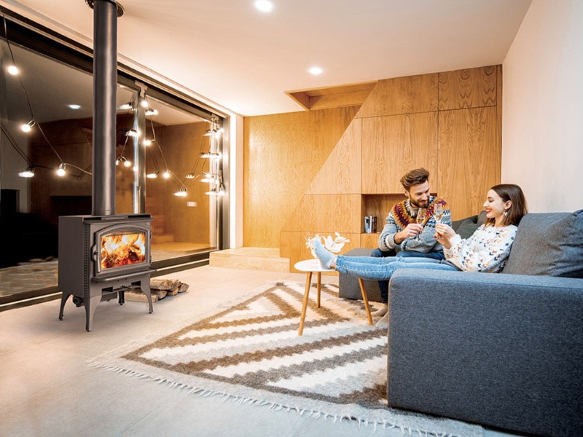 Couple enjoying at cozy home in front of one of the Wood Stove Brands Option