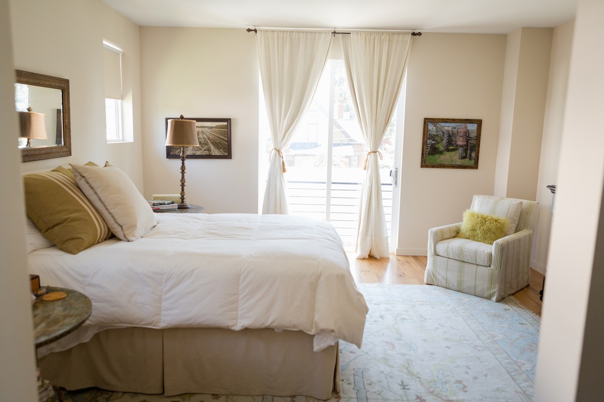 An airy and light-colored beige bedroom.