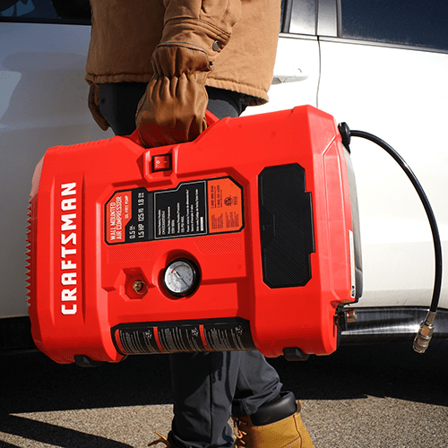 Craftsman Wall-Mounted Compressor Carried to the Garage