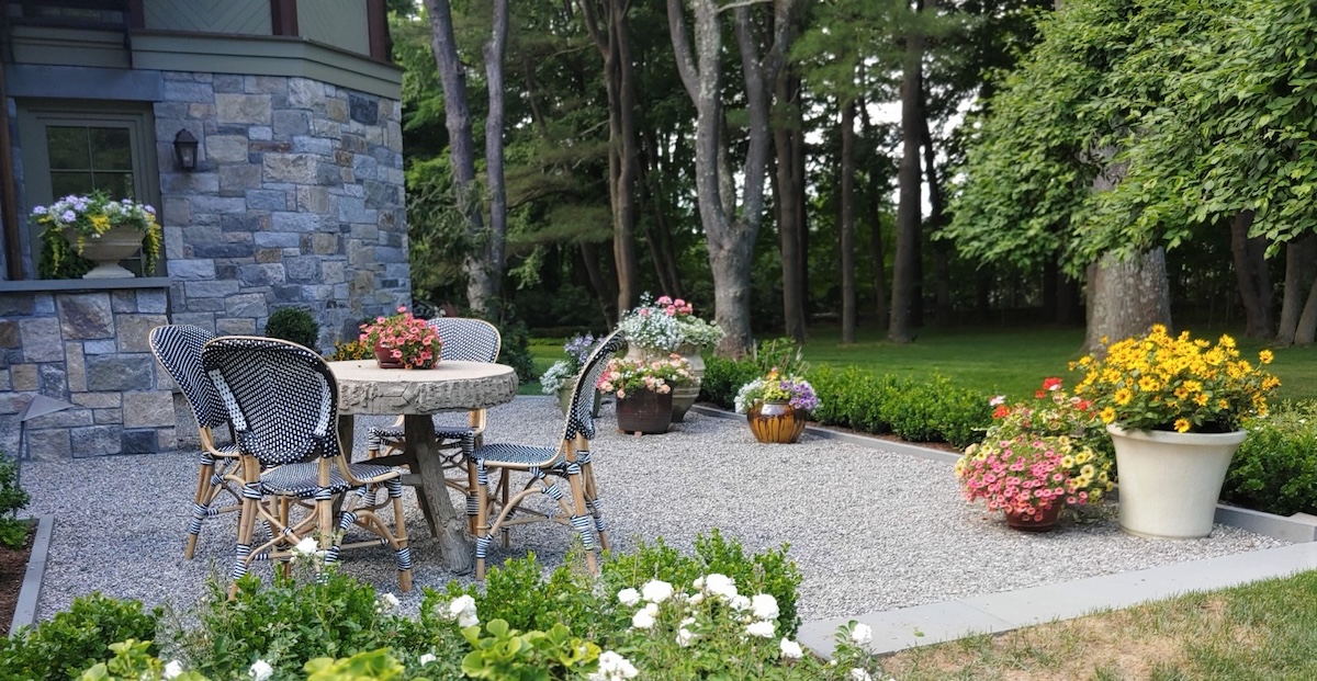 Hardscaping gravel patio in a backyard.